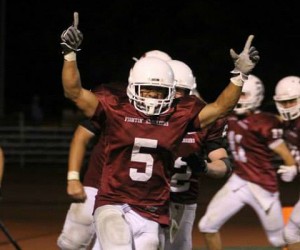 Greg Lee celebrates scoring the winning touchdown in a game that went into three overtimes and tied the record for most points in a game in D-III history. (Rose-Hulman athletics photo)