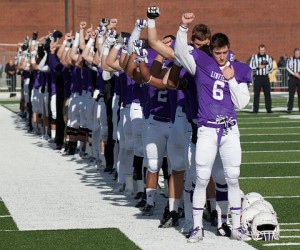 Linfield honored fallen teammate Parker Moore before taking the field against Chapman, then did so again on its first offensive play from scrimmage. (Photo by B. Scott Presley, d3photography.com)